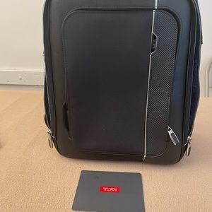 Purchased the Tumi backpack that I’m too old to be carrying one.